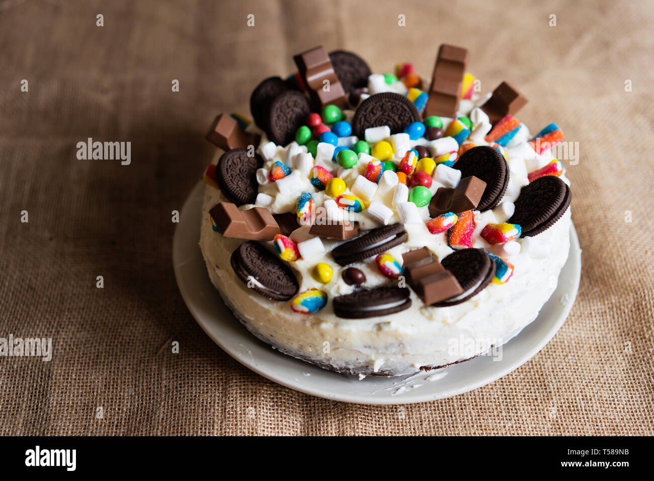 homemade birthday cake decorated with chocolate pieces, cookies ...