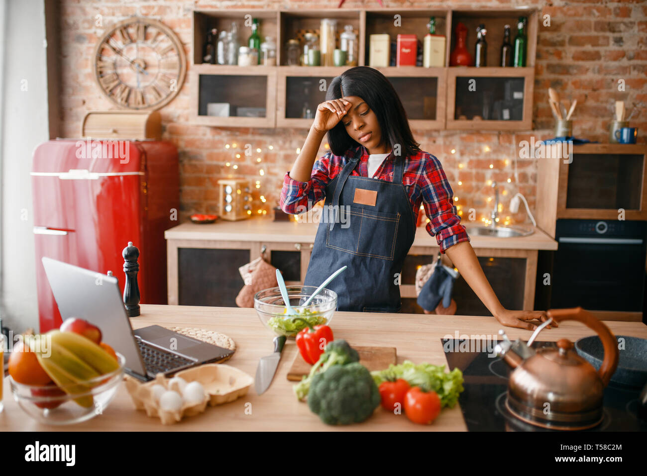 Sleepy Black Woman In Apron Cooking On The Kitchen Stock Photo Alamy sleepy-black-woman-in-apron-cooking-on-the-kitchen-stock-photo-alamy