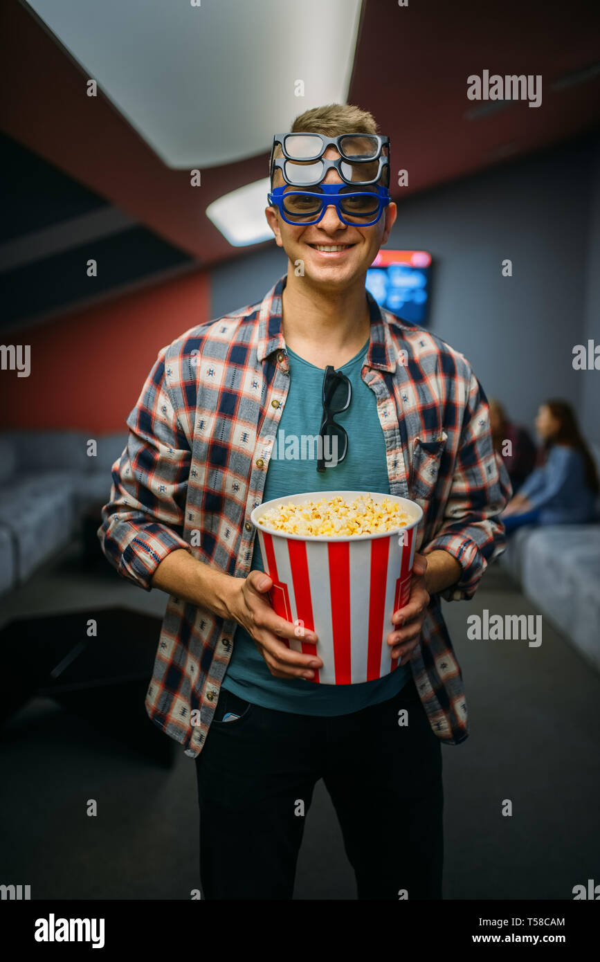 Male spectator in 3d glasses, cinema hall Stock Photo