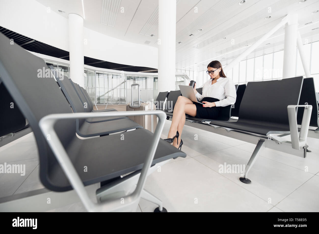 Beautiful business woman waiting airport hi-res stock photography and ...