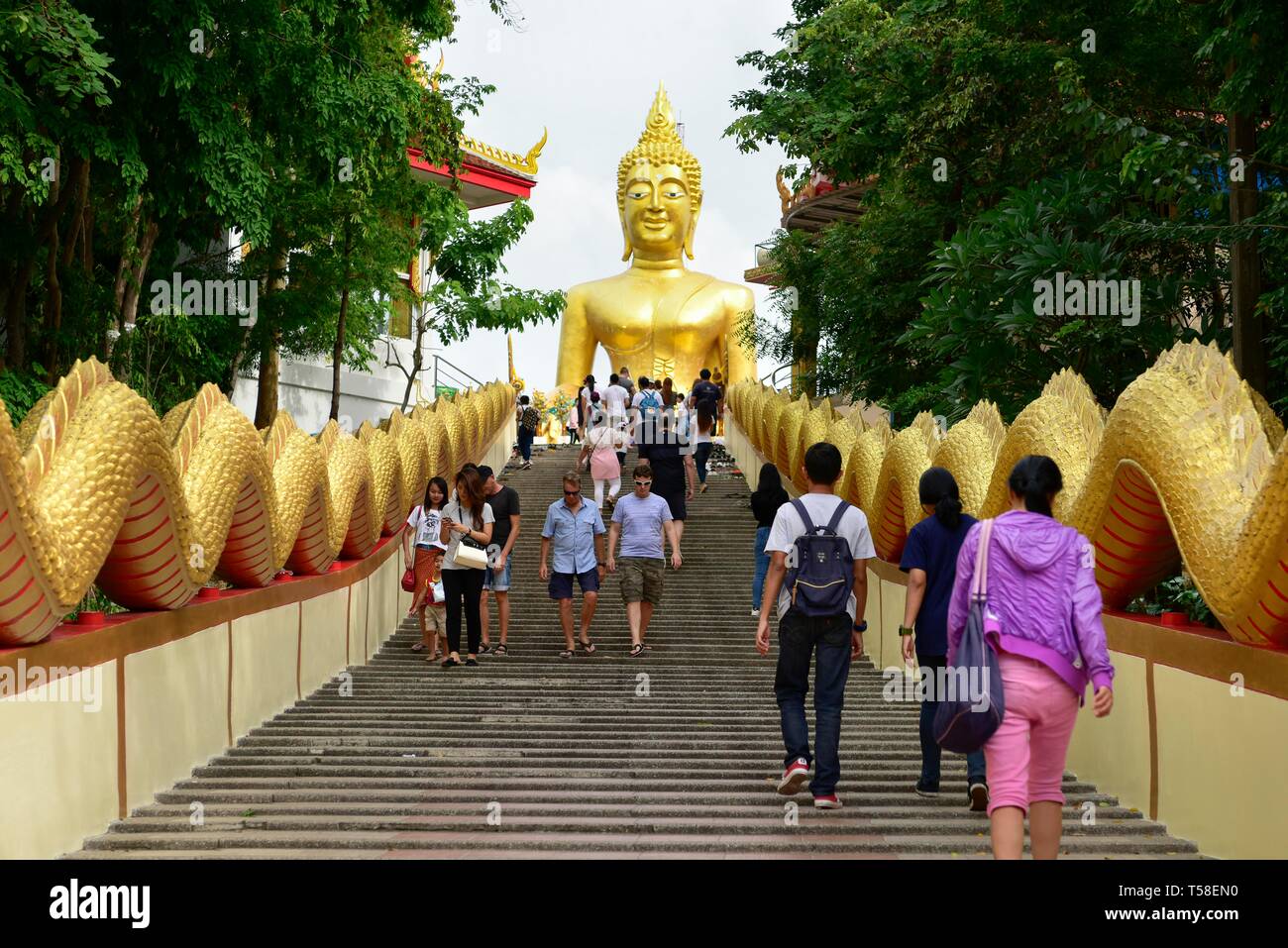 Tourists on stairs to Wat Phra Yai Temple, Golden Buddha Statue, Pattaya, Chon Buri Province, Thailand Stock Photo