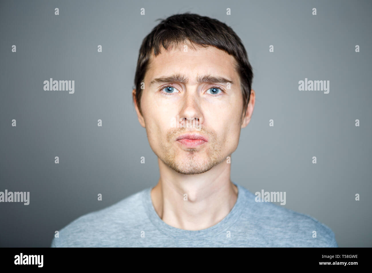 Young brunette on empty background Stock Photo