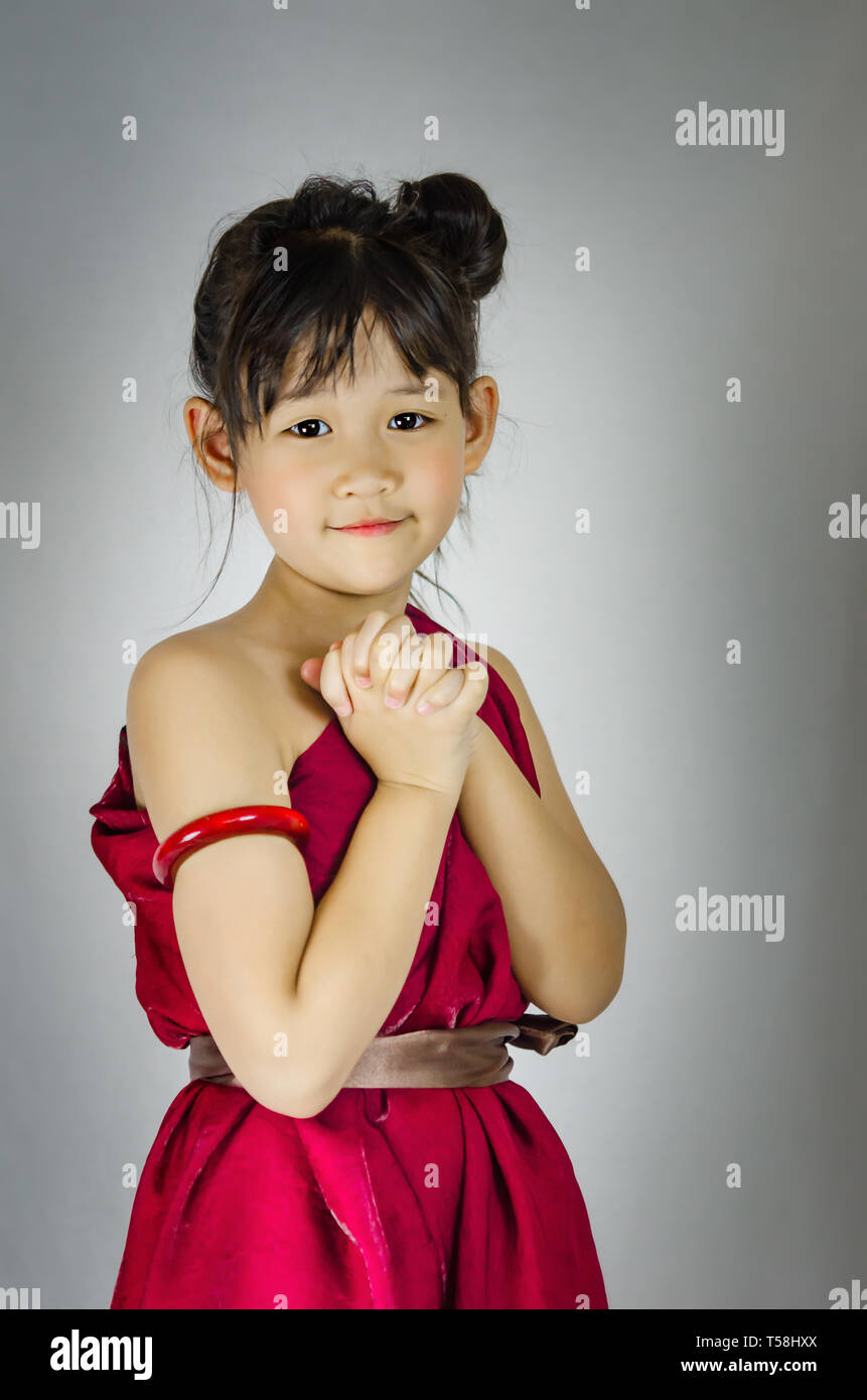 Portrait of asian little girl in red dress Stock Photo - Alamy