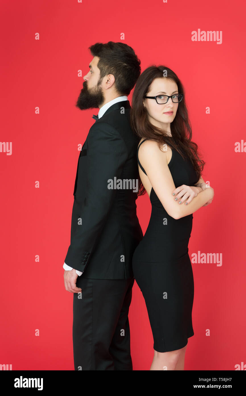 Man bearded hipster and woman in formal dress red background. Formal ...