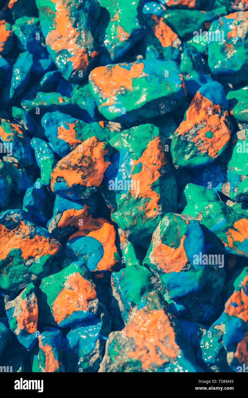 stones with different paint lie on the surface, a top view Stock Photo