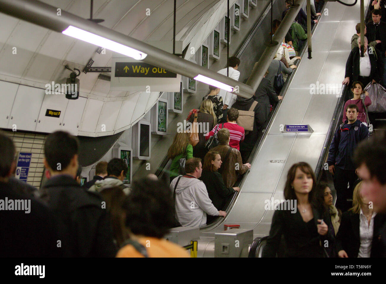 Commuters travelling on escalators during their daily commute on the London underground. 09/09