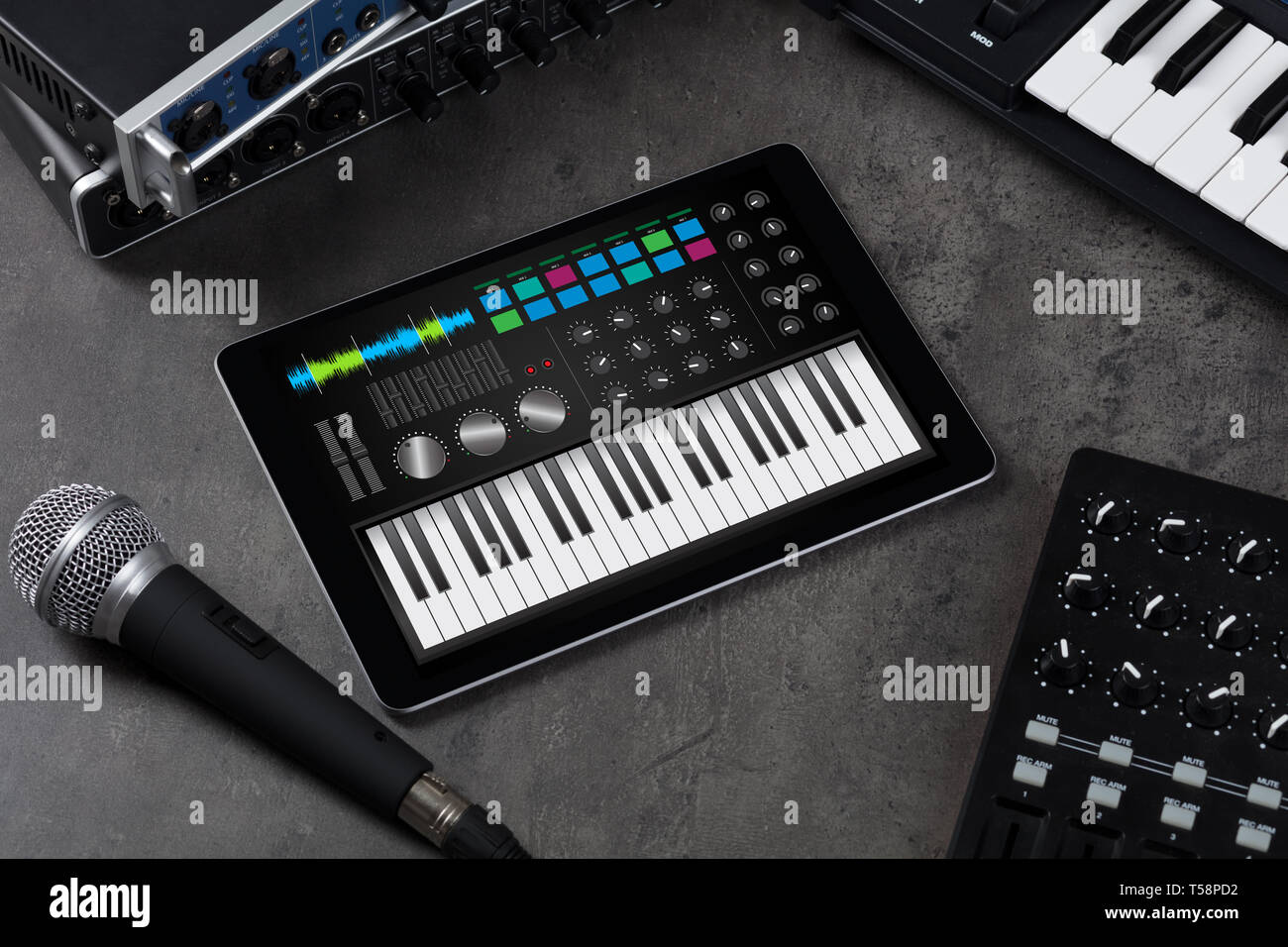 Piano synthesizer app on tablet and musical instrument concept Stock