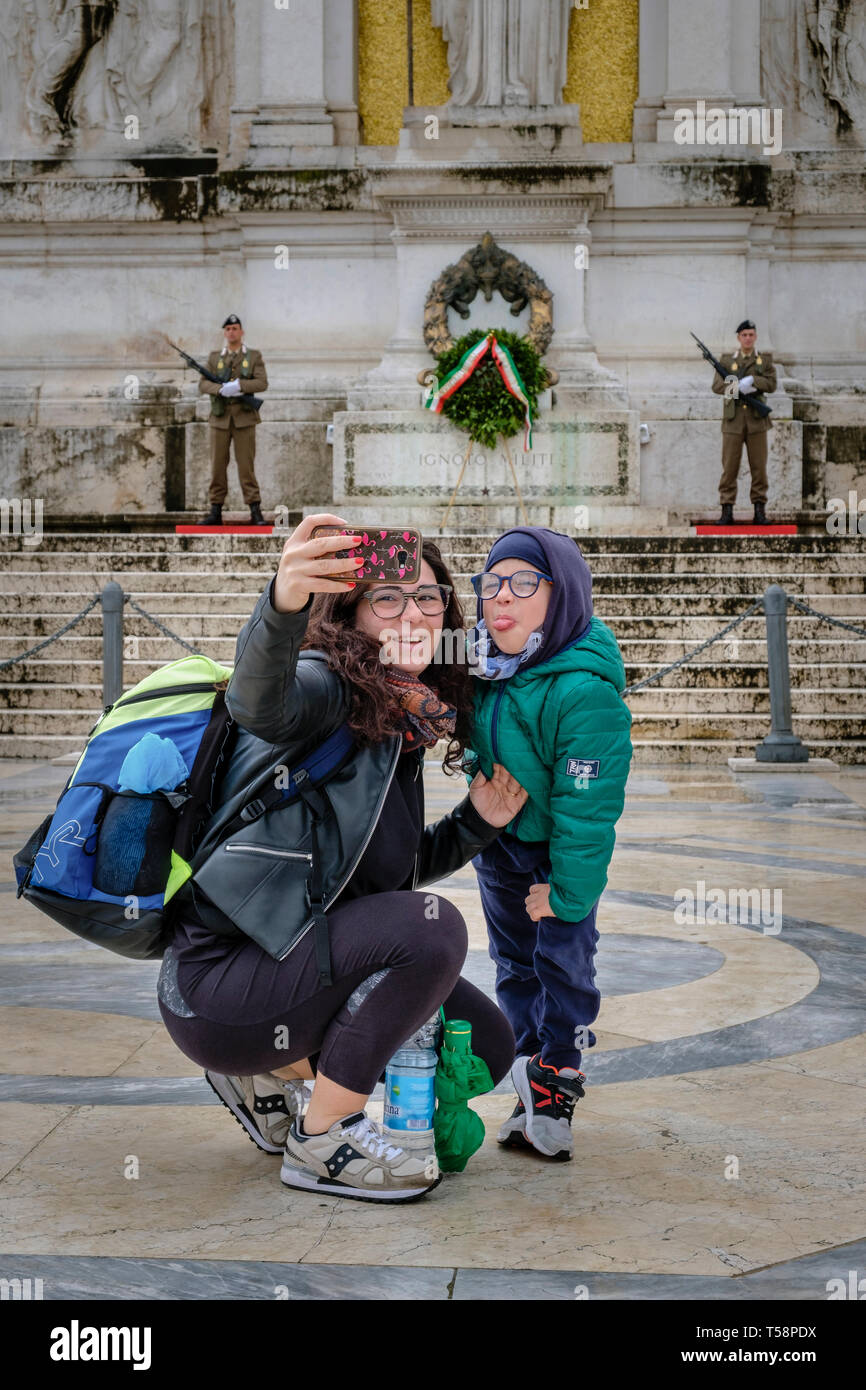 Tourists taking a selfie at the Tomb of the Unknown Soldier, Piazza Venezia, Rome, Italy Stock Photo