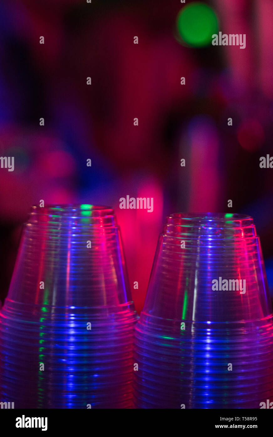 Stacks of plastic water cups in colorful Water Station Stock