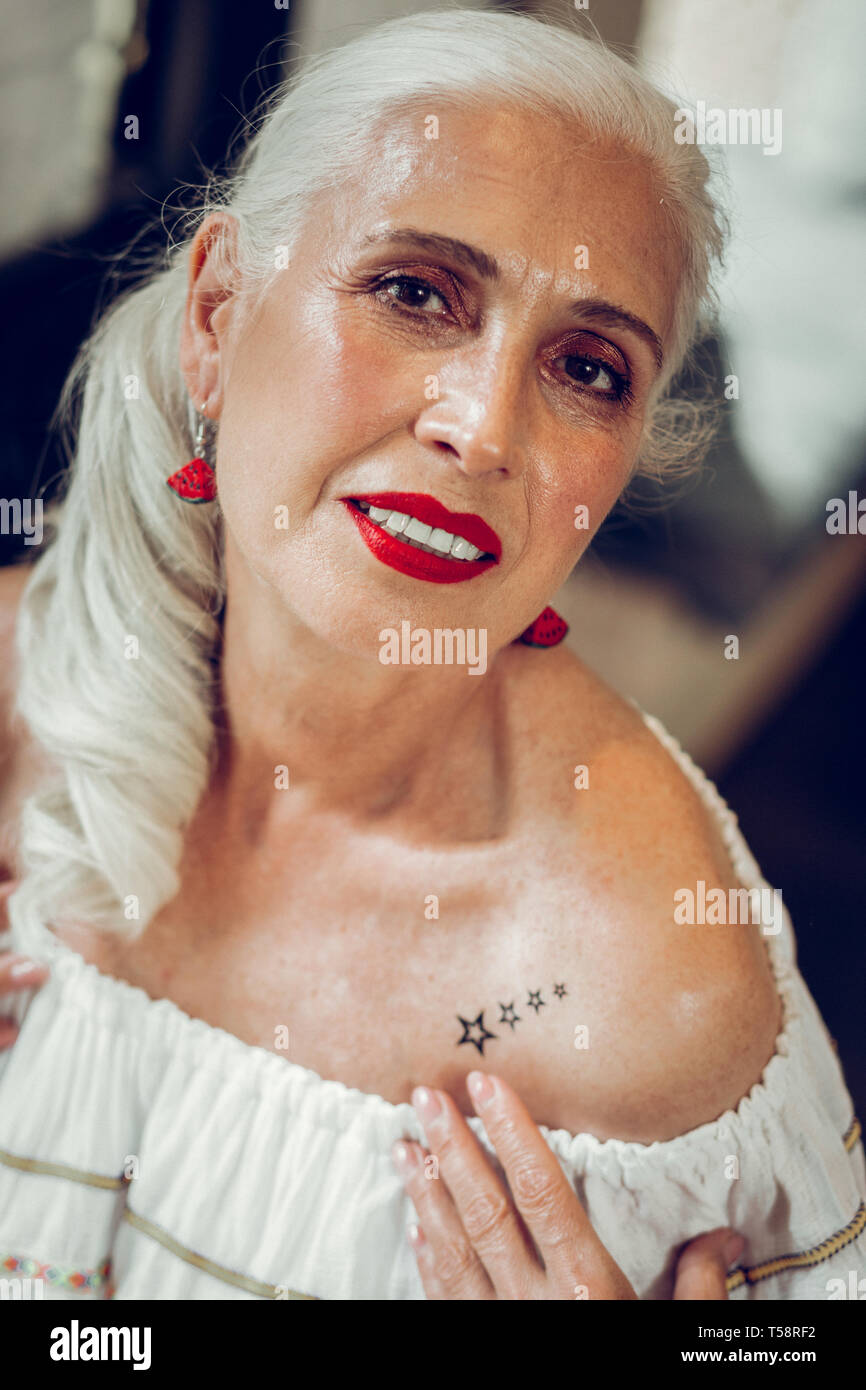 Beautiful mature woman tattoo hi-res stock photography and images - Alamy