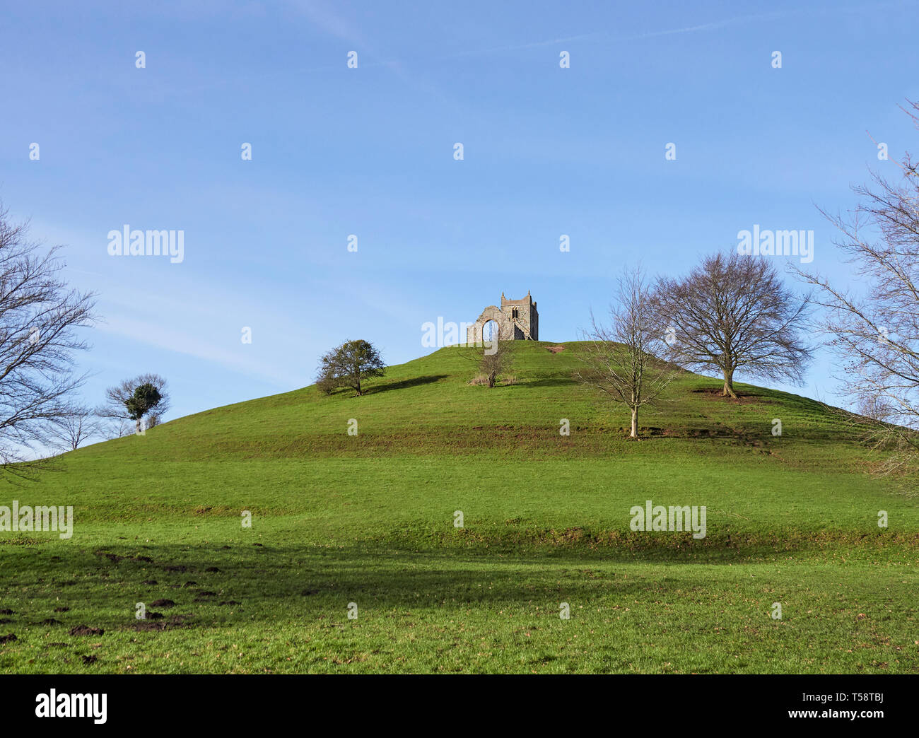 Burrow Mump Norman motte and ruined St Michaels church in the village of Burrowbridge Somerset overlooking Southlake Moor part of the Somerset Levels Stock Photo