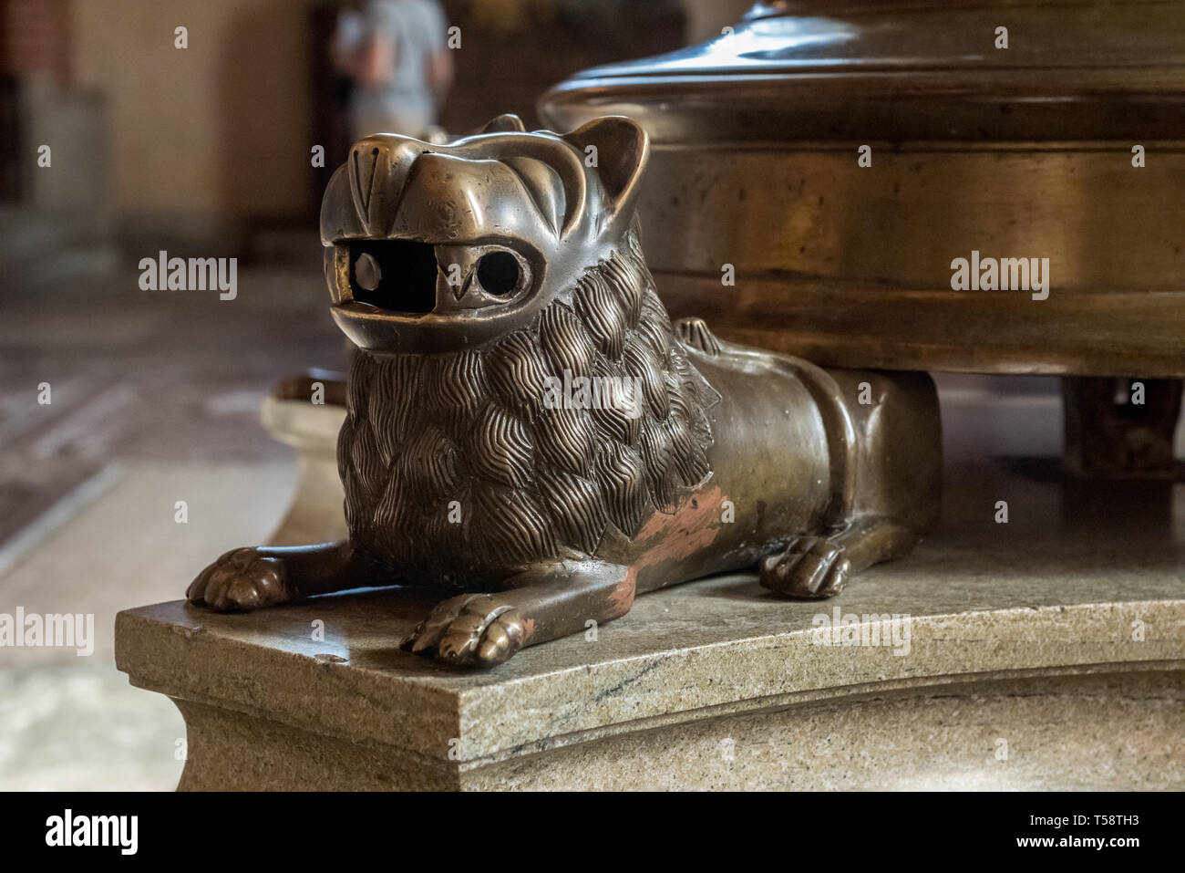 Stylised bronze lions support the 600 year old, 3.7 metre tall, seven-branched candlestick in Storkyrkan (Stockholm Cathedral). Stock Photo