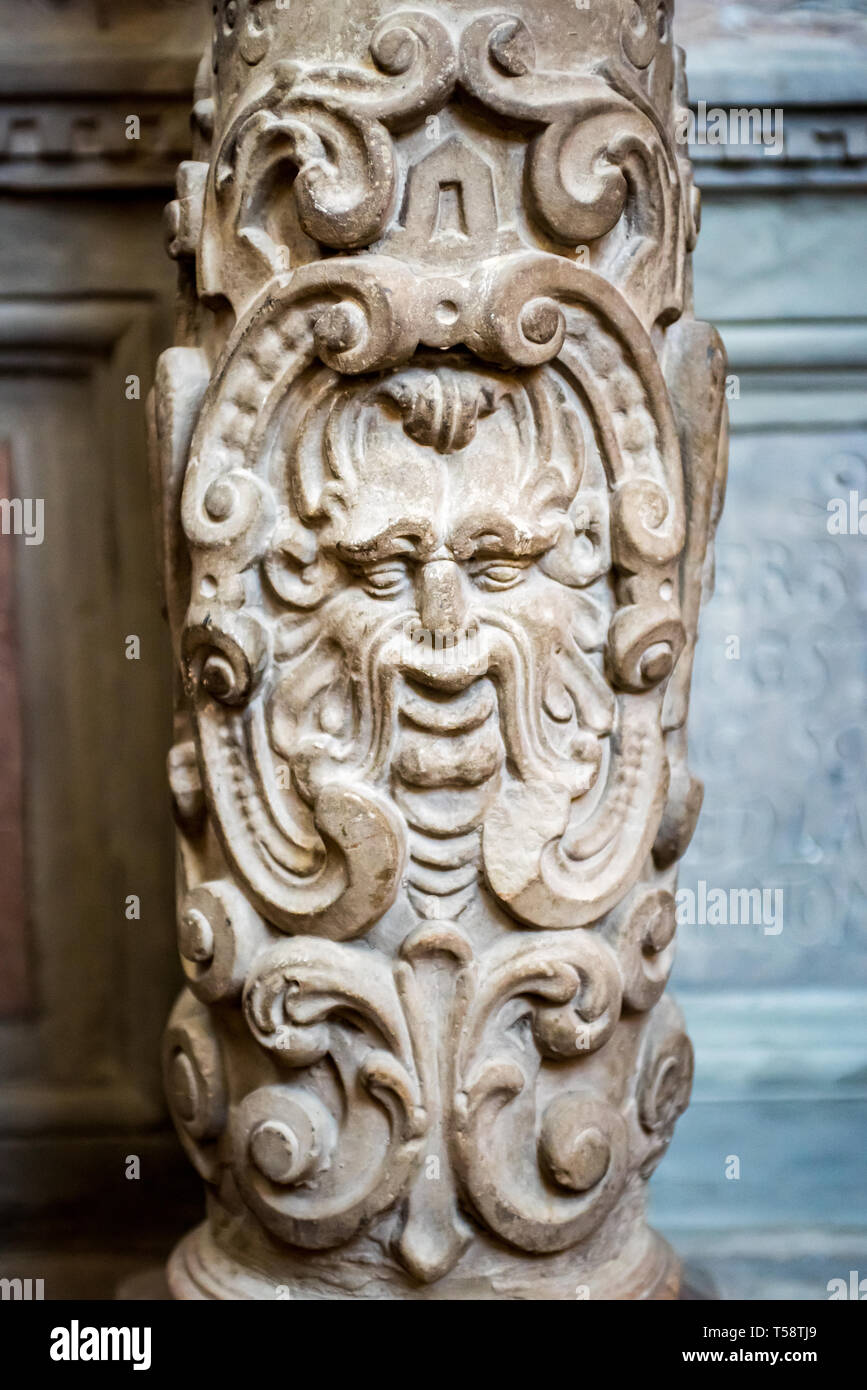 The stone carving of a bearded man's face on a pillar in Stockholm's Storkyrkan (Cathedral) Stock Photo