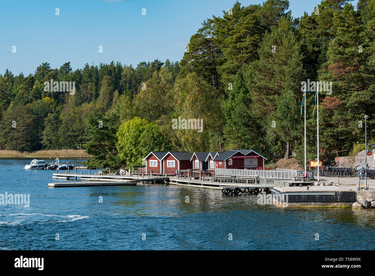 Tiny wooden fishermen's huts are popular with tourists and locals alike as accommodation while exploring the Stockholm archipelago during the summer Stock Photo