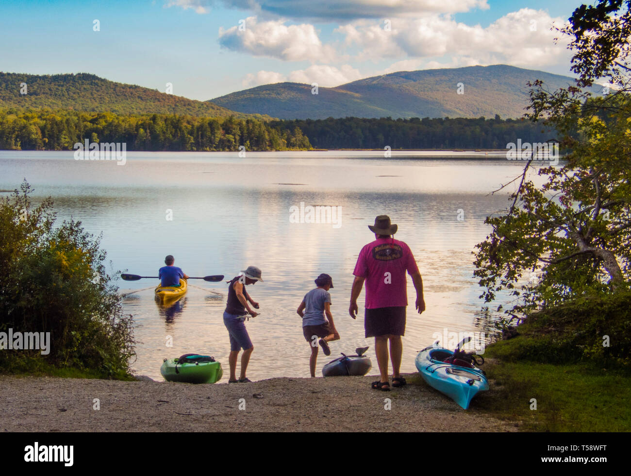 Kayakers ready to launch into scenic Lake Nineva, in Vermont. Stock Photo