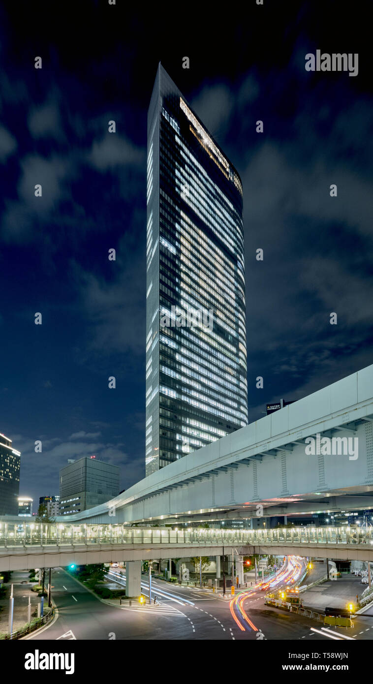Office building in Shiodome area at night, Tokyo, Japan Stock Photo