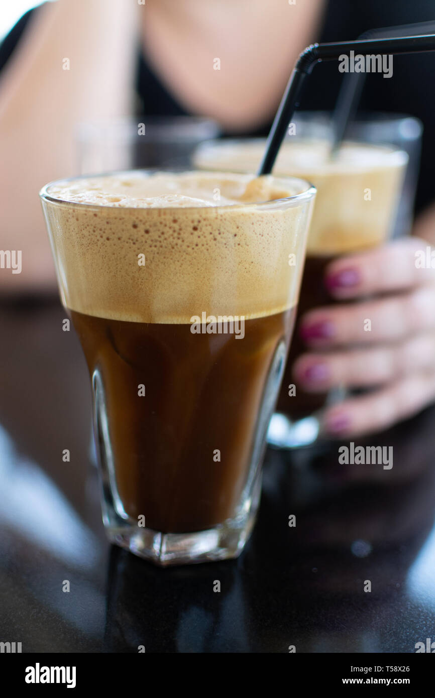 Traditional greek cold coffee Frappe with foam made from water, instant ...