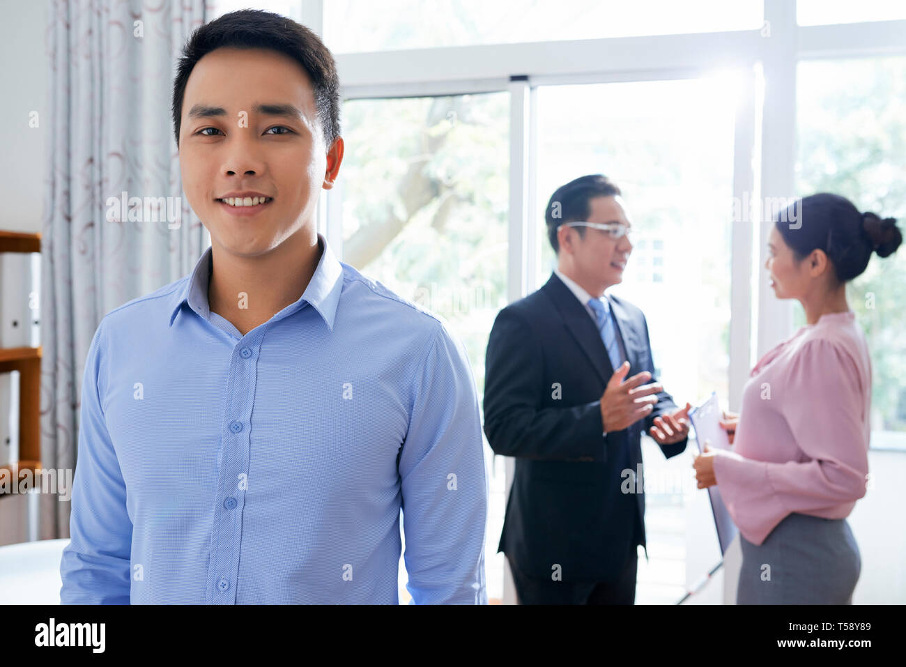 Happy employee in office Stock Photo