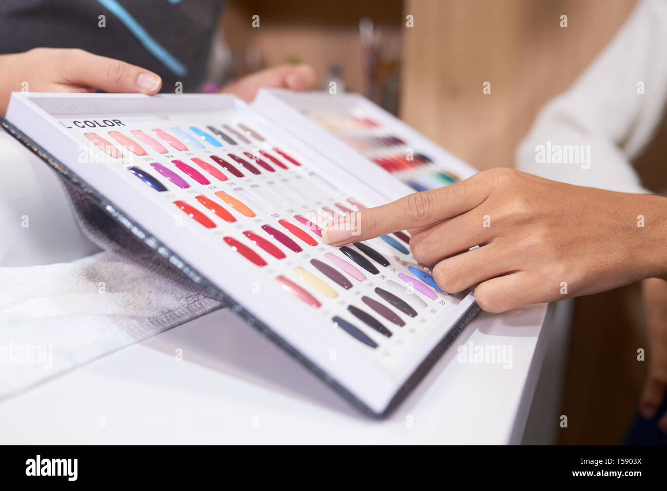 Pointing at color of nail polish Stock Photo