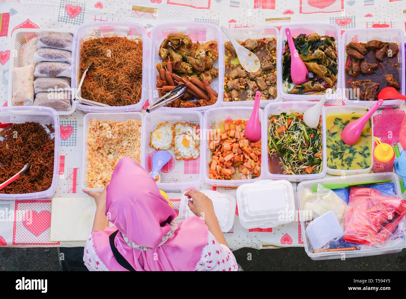 Overhead shot of delicious Malaysian home cooked dishes sold at street market stall in Kota Kinabalu Sabah. Stock Photo