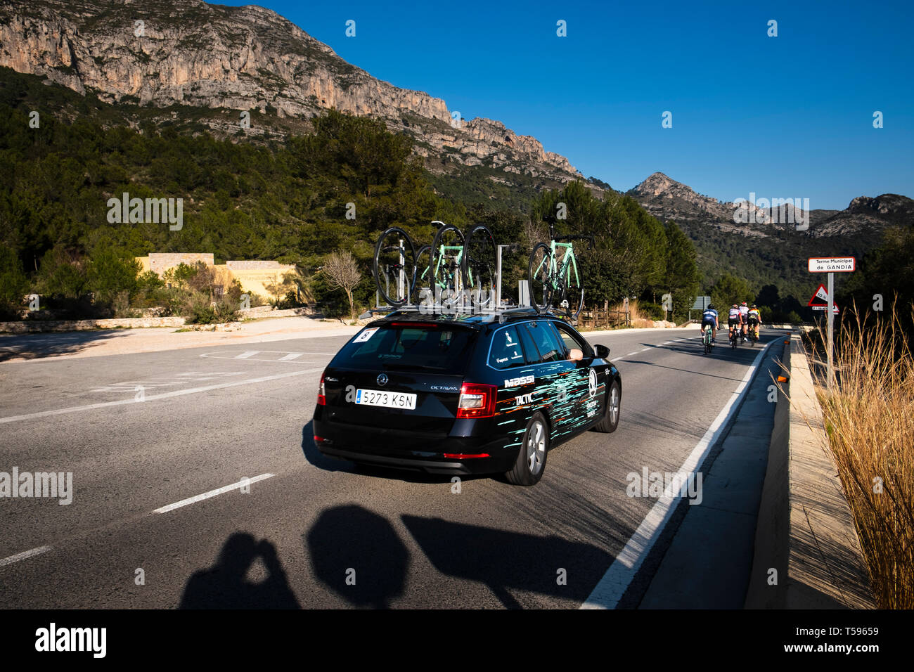 Woman's Cycle race support vehicles La Safor mountains near Gandia Spain Stock Photo