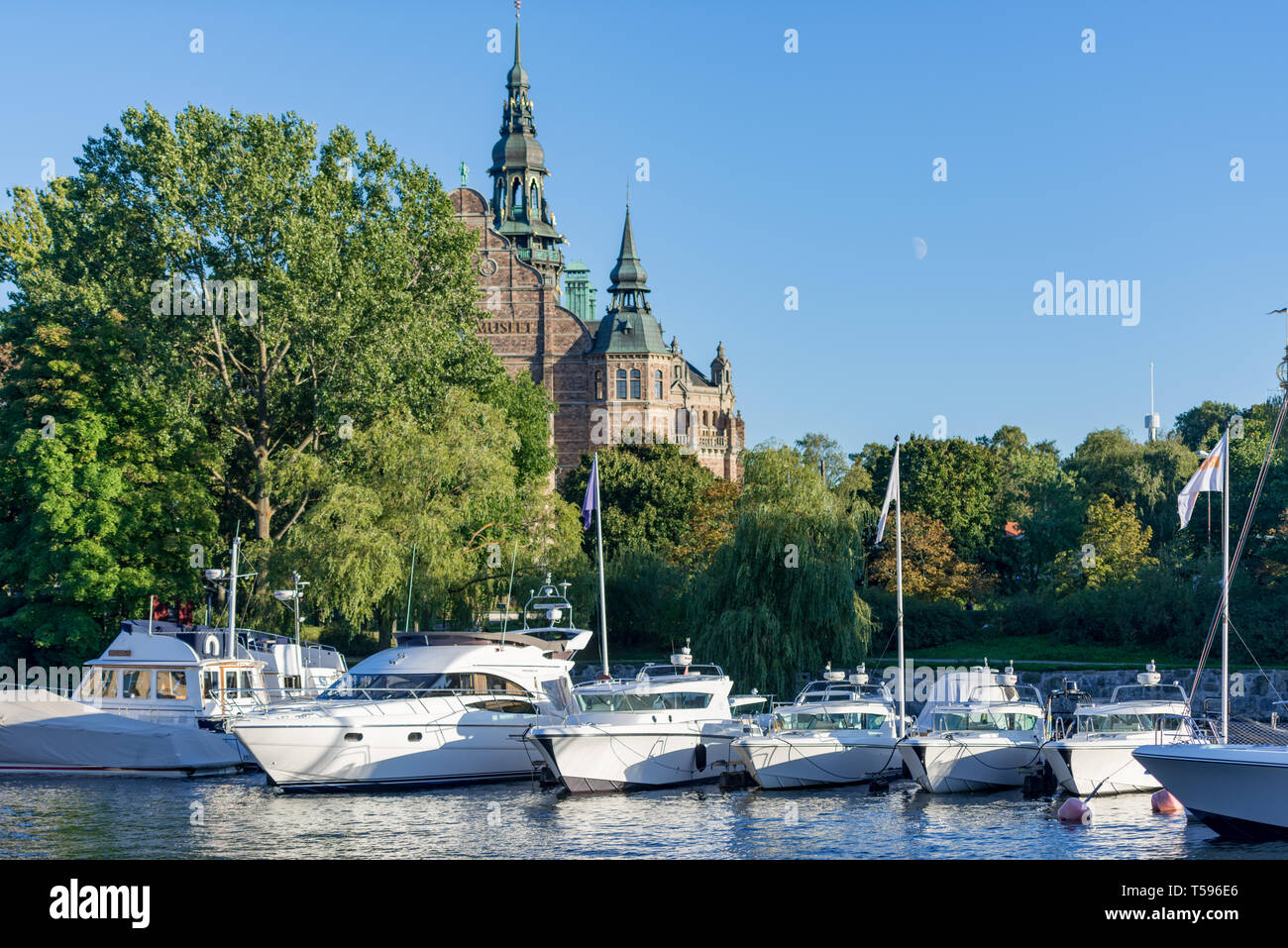 Boats moored on Ladugårdslandsviken in front of the Nordic Museum at Djurgården, Stockholm Stock Photo
