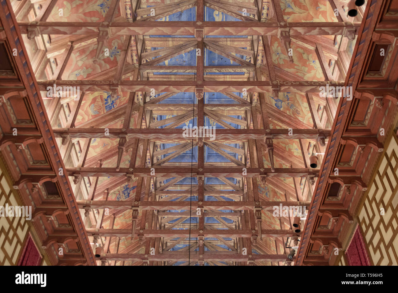 The elaborately painted wooden ceiling of the City Council chamber in Stockholm City Hall.The ceiling was built in the style of a Viking longhouse. Stock Photo