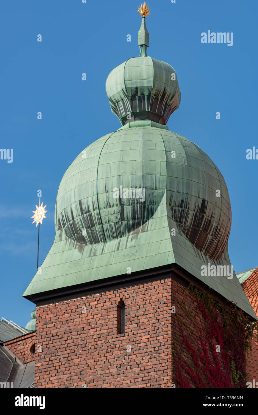 An oriental style onion dome tops an austere brick-built tower in the courtyard of the Stadshuset (City Hall) in Stockholm. Stock Photo