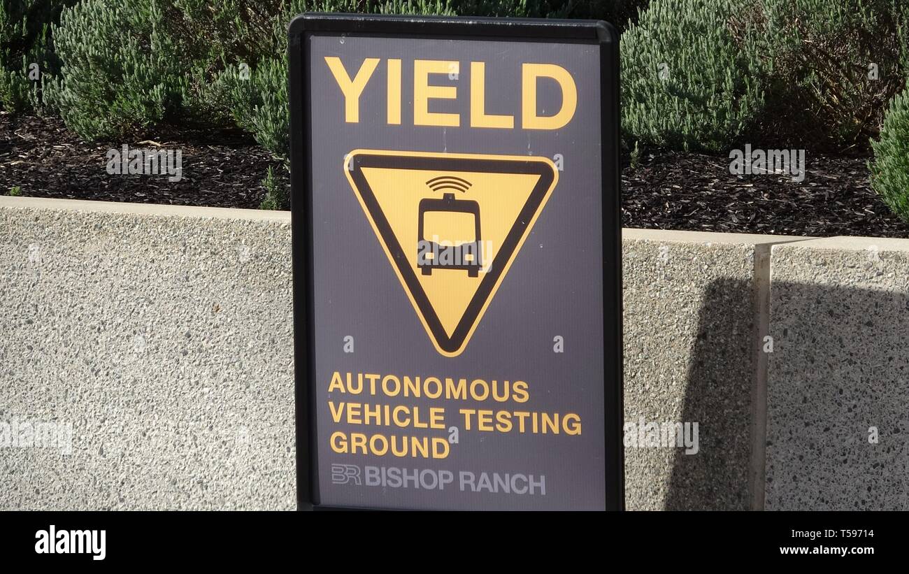Close-up of sign reading Yield Autonomous Vehicle Testing, warning motorists to yield to self driving shuttles being tested at the Bishop Ranch office park in San Ramon, California, March 12, 2019. () Stock Photo