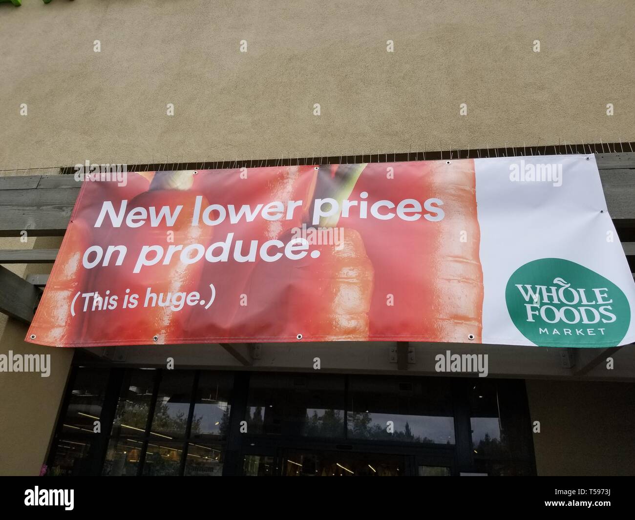 Sign outside Whole Foods Market grocery store in San Ramon, California, following parent company Amazon's announcement that it was cutting produce prices at the store, April 3, 2019. () Stock Photo