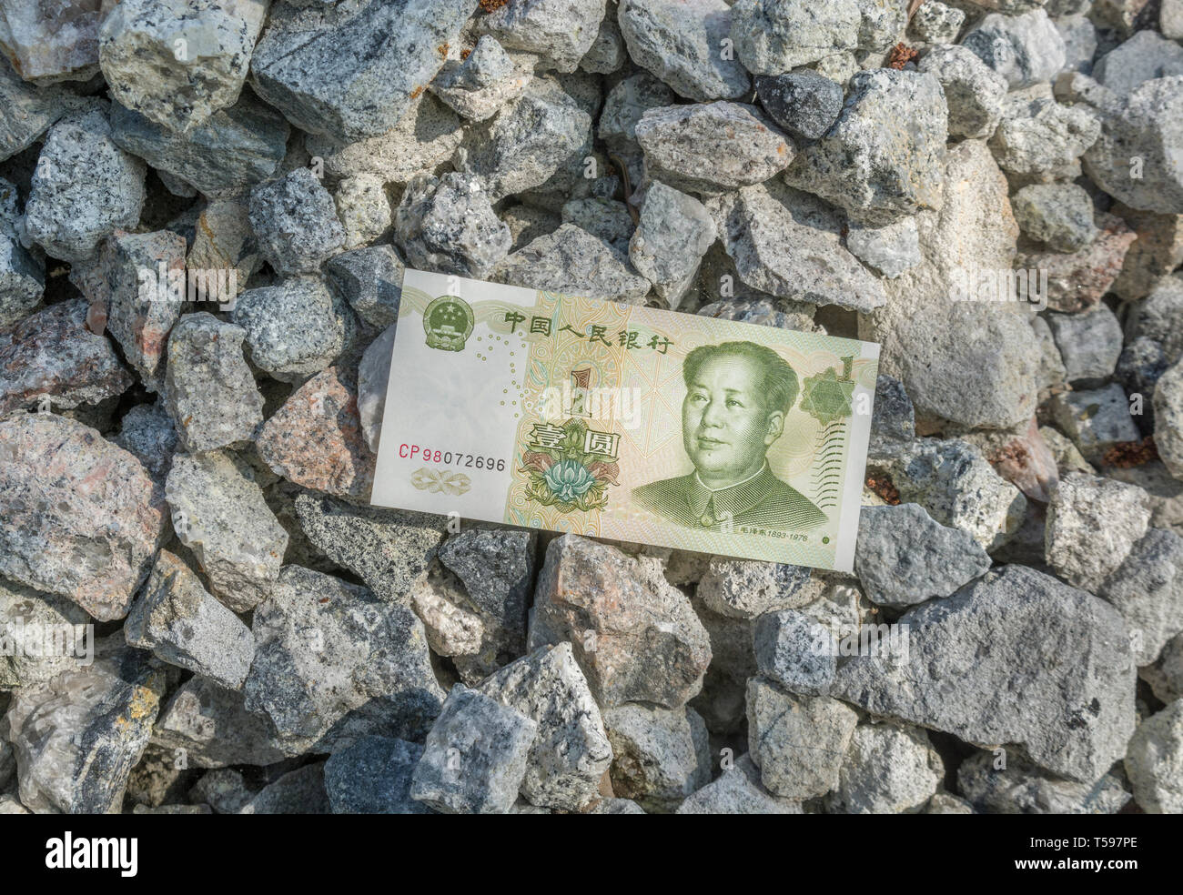 Chinese Yuan Renminbi / economy hits rock bottom metaphor, Yuan hits the floor, Yuan price tumbles, China debt crisis, falling yuan, trade war China Stock Photo