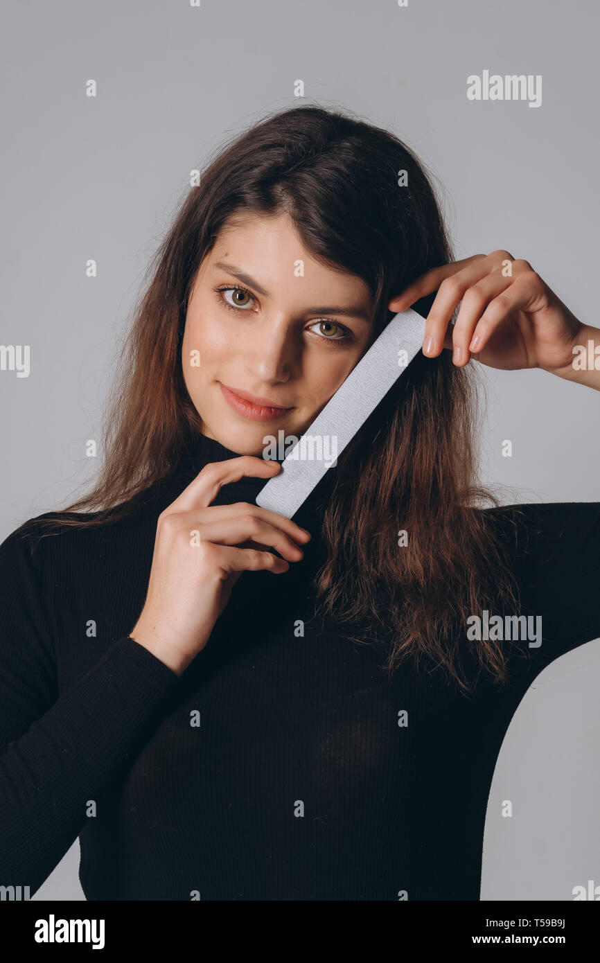 Portrait of a pretty smiling woman posing isolated Stock Photo - Alamy