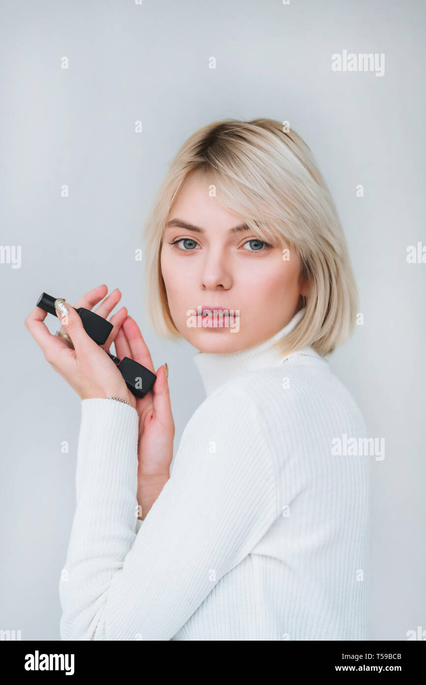 Portrait of a pretty smiling woman posing isolated Stock Photo - Alamy