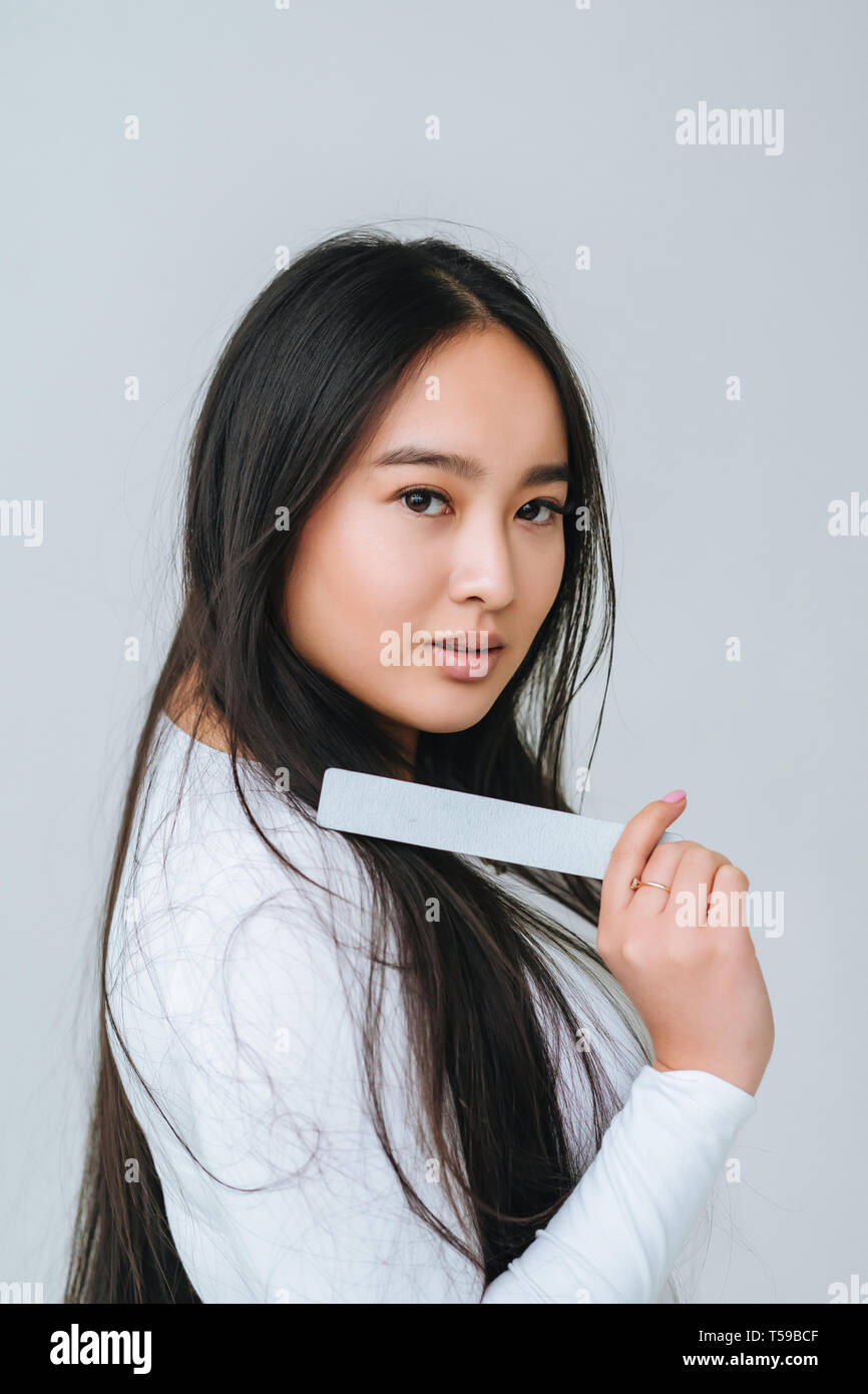 Portrait of a pretty smiling woman posing isolated Stock Photo - Alamy