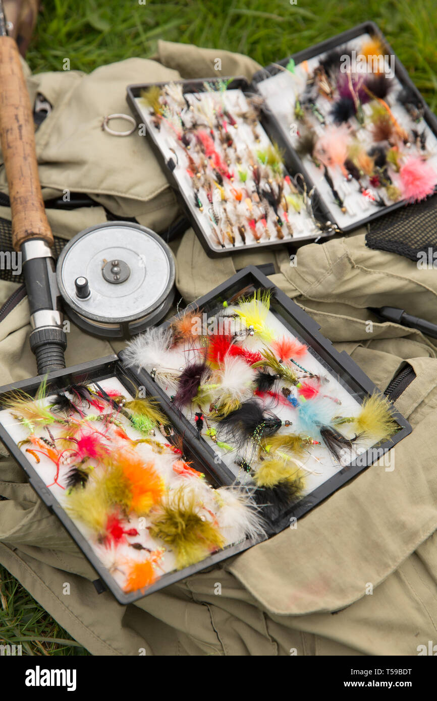 An angler’s vest with a five weight flyfishing rod fitted with an old