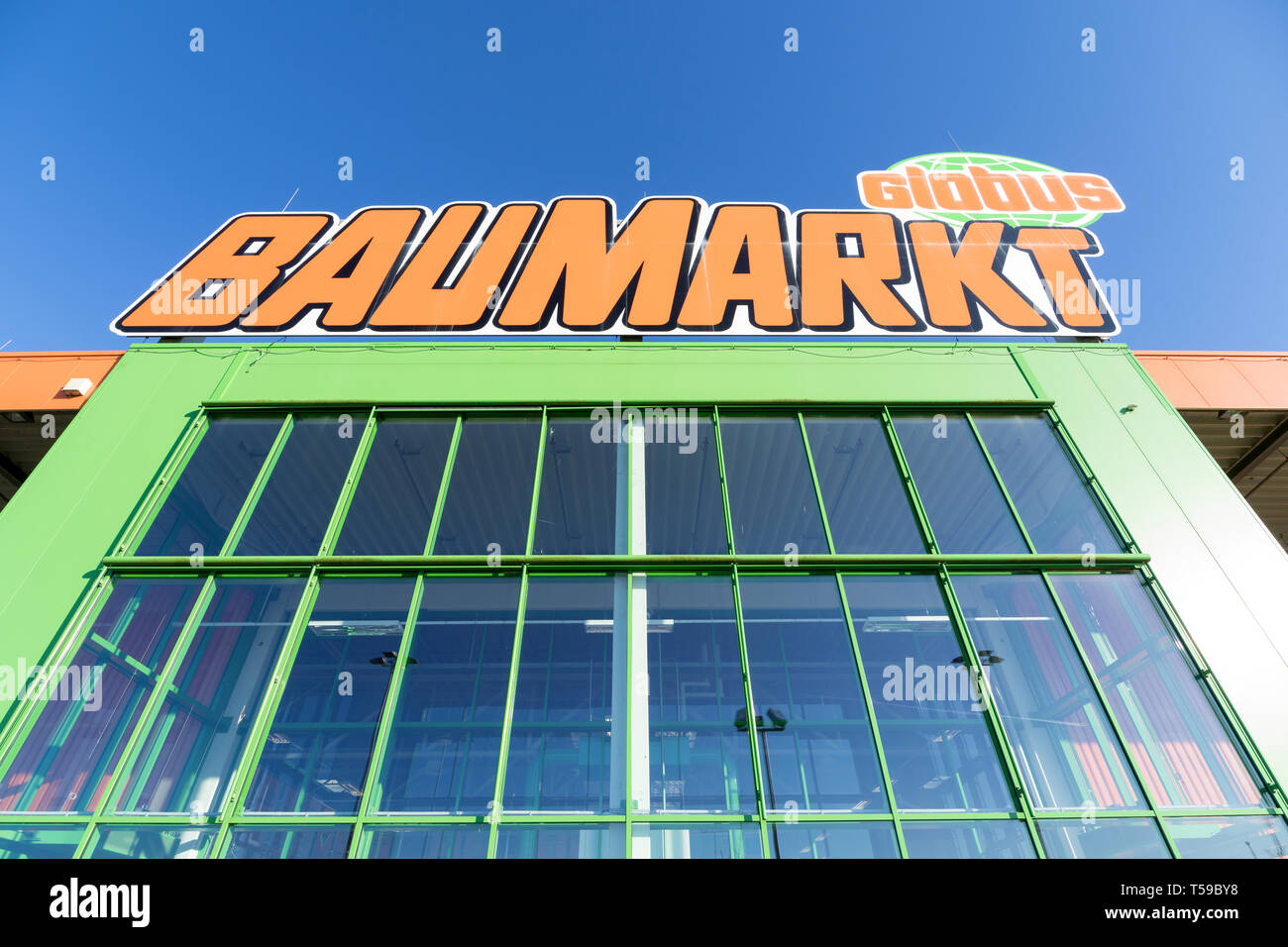 Globus sign at store. Globus is a German retail chain of hypermarkets, DIY stores and electronics stores - Alamy