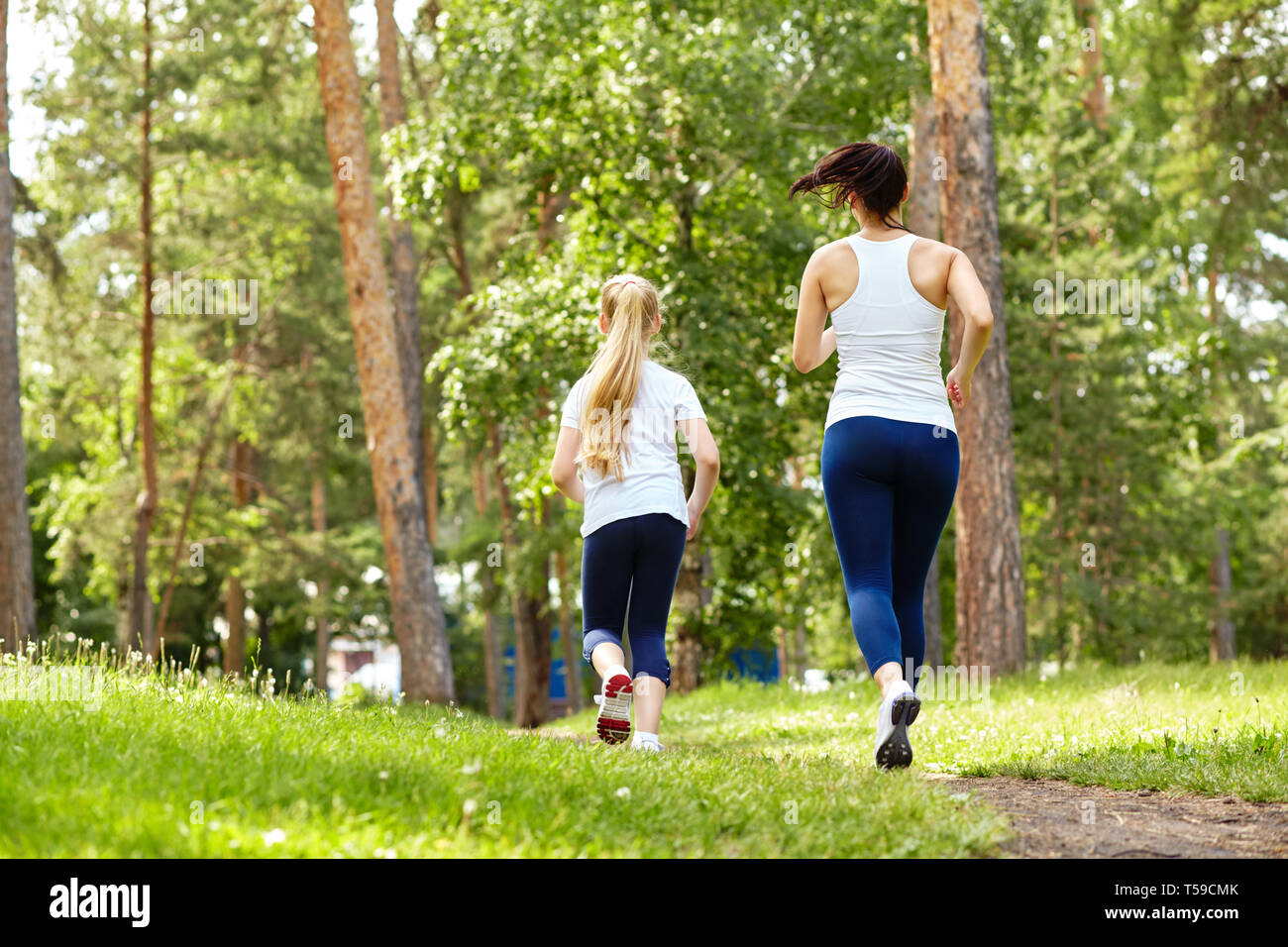 Woman jogging in the park  Women, Jogging, Girl short hair