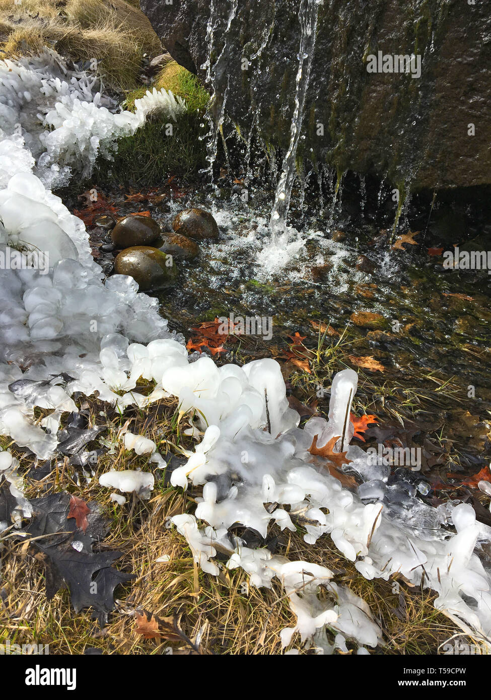 Waterfall spring thaw with ice shapes, 2017. Stock Photo