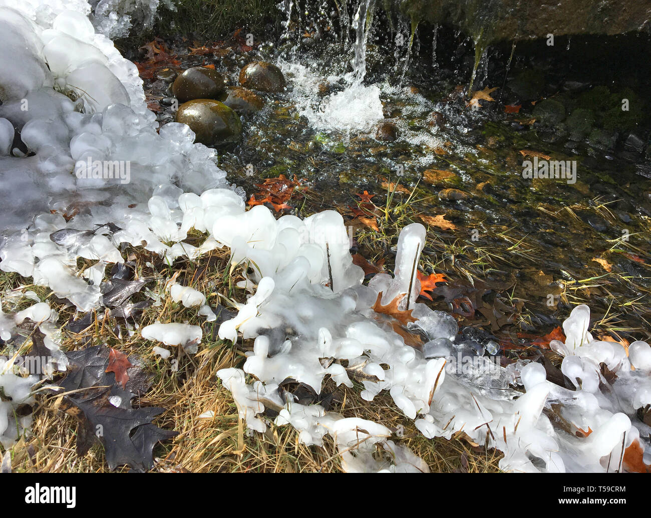 Waterfall spring thaw with ice shapes, 2017. Stock Photo