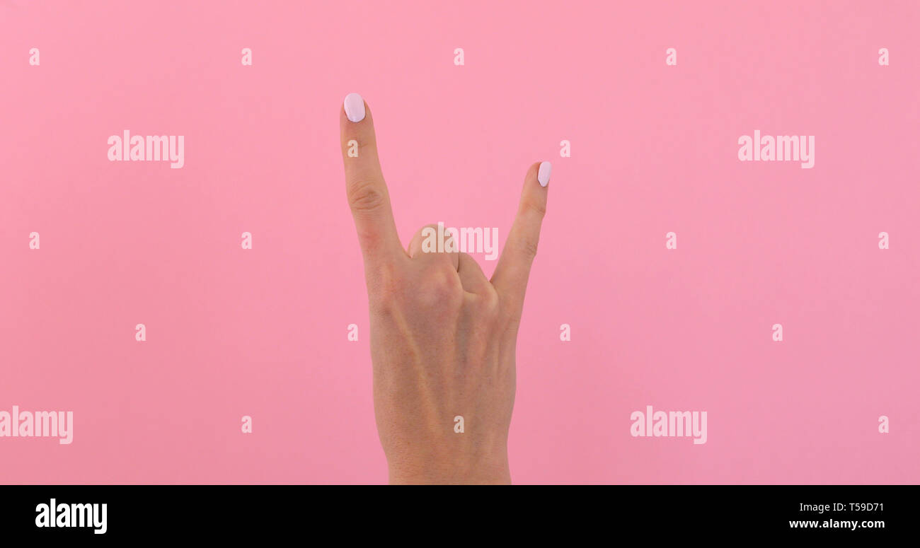 Hand gesturing heavy metal rock sign Stock Photo Alamy