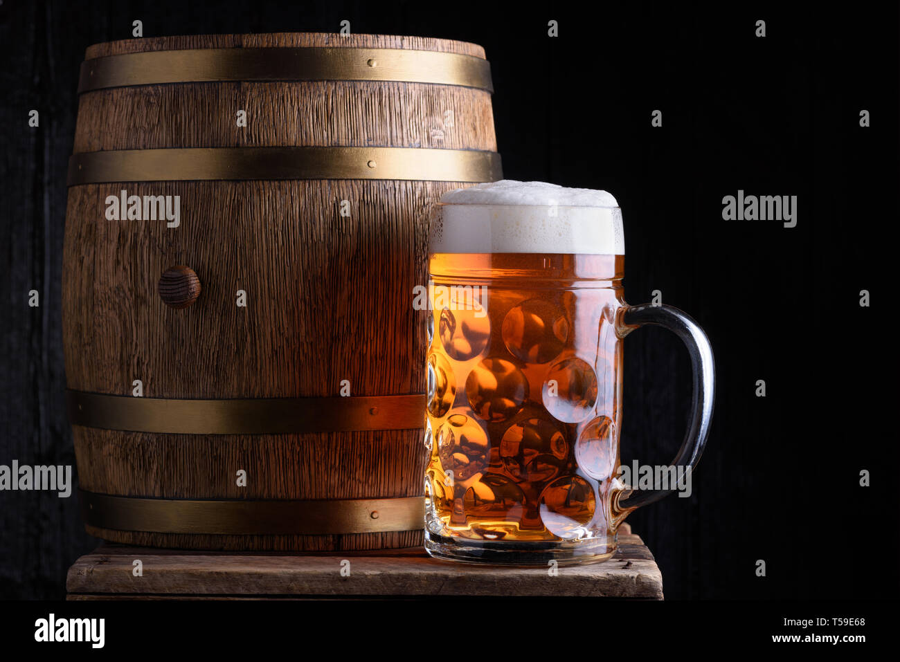 Big beer mug and beer barrel on wooden table still life Stock Photo - Alamy
