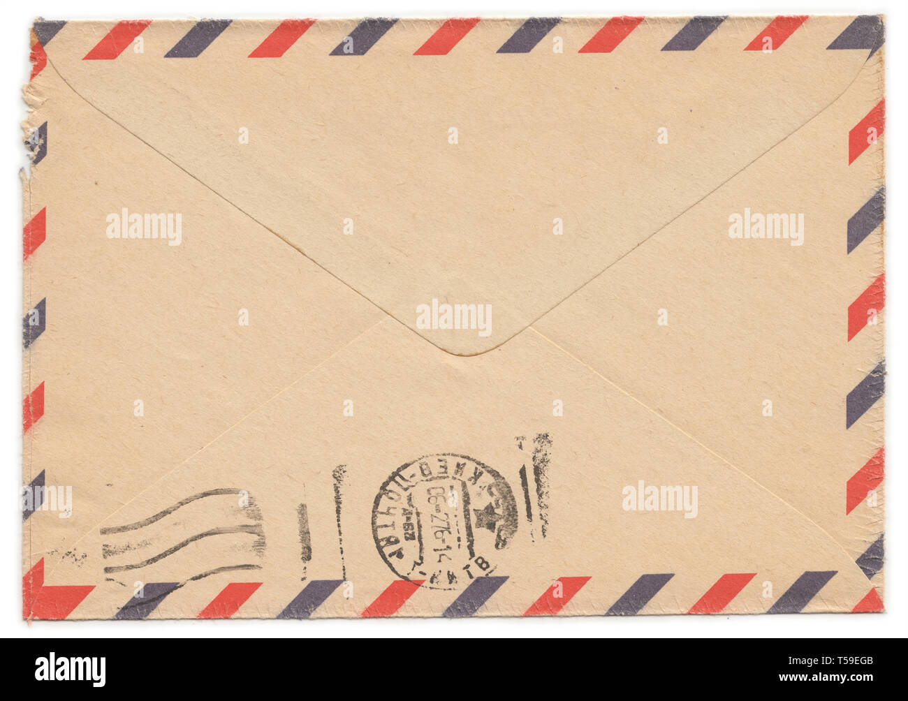 Old worn paper envelope with meter stamp on rear side Stock Photo