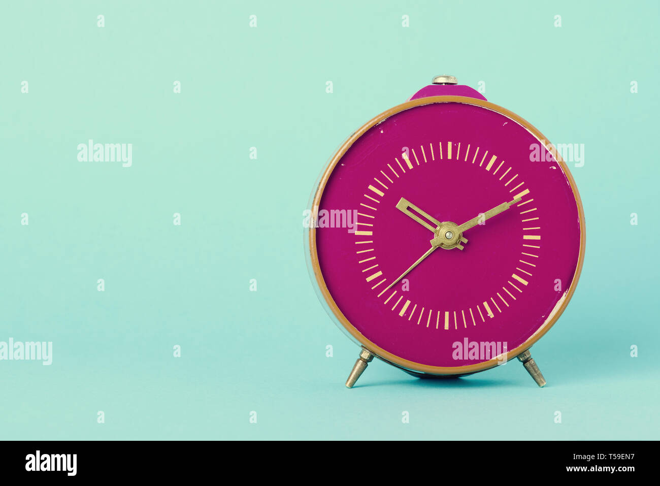 Retro clock on blue background with copy space, vintage toned Stock ...