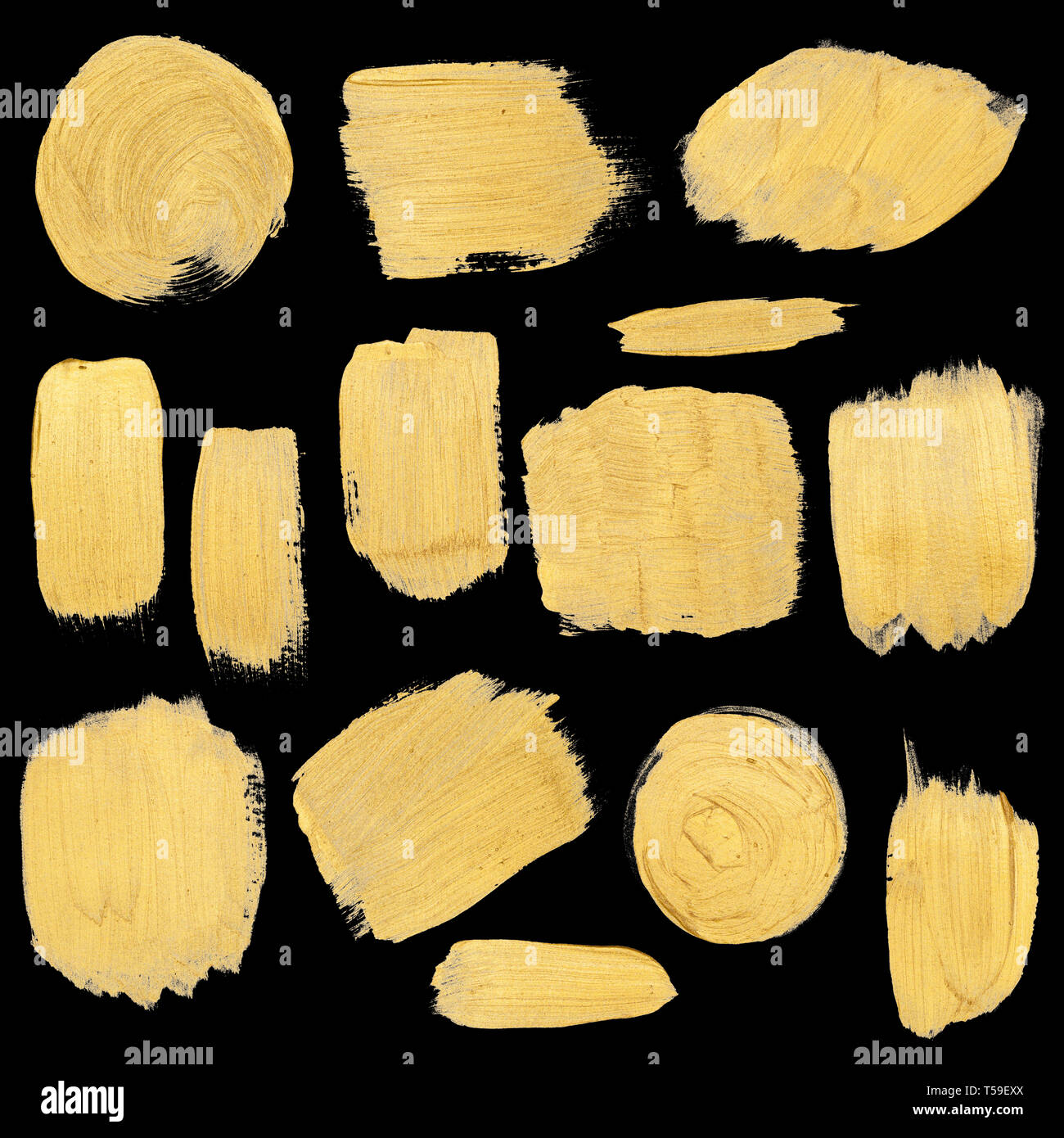 Gold paint stokes isolated on black background Stock Photo