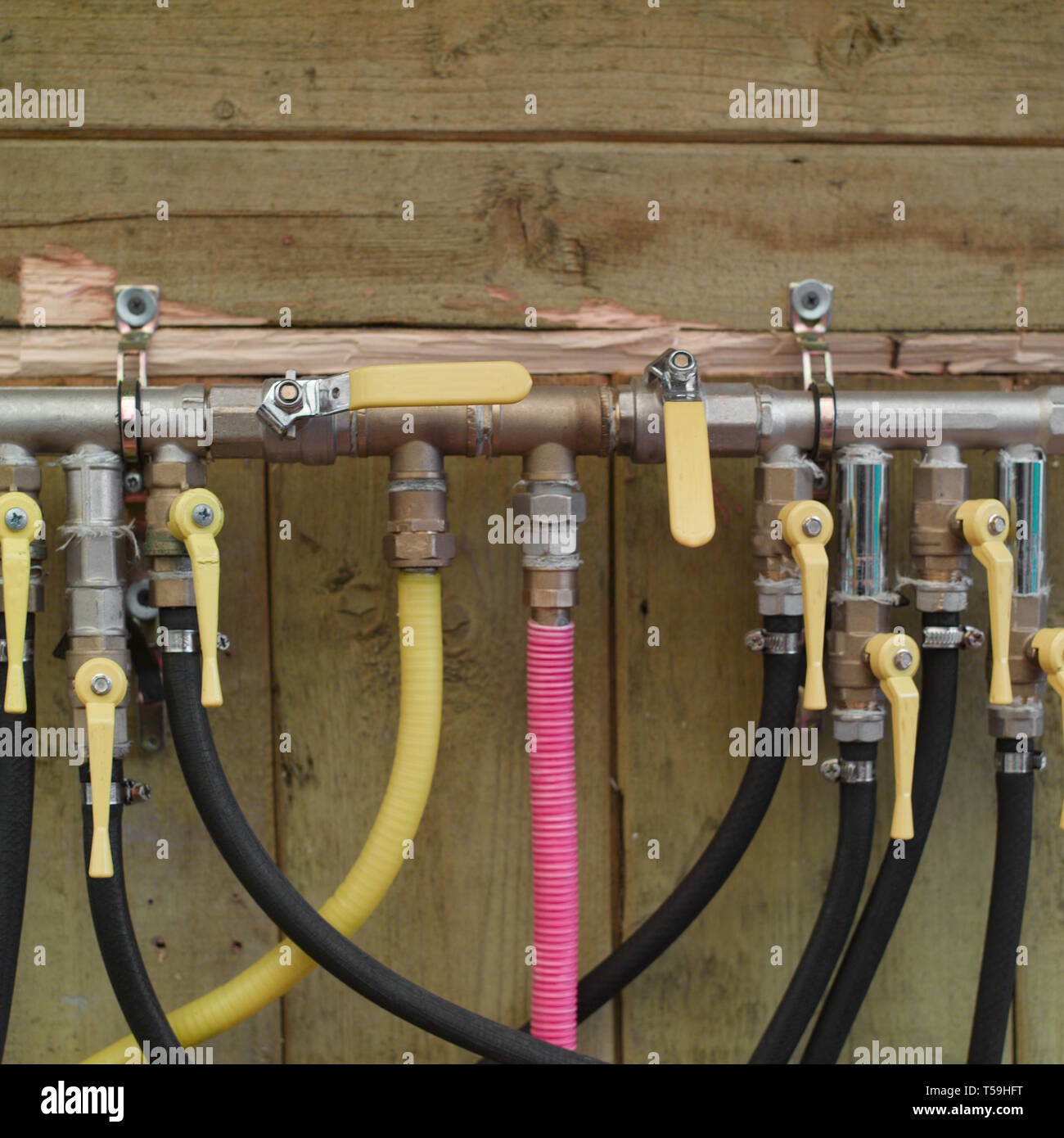 Various LPG gas equipment mounted on a wooden wall, outdoor close-up Stock  Photo - Alamy
