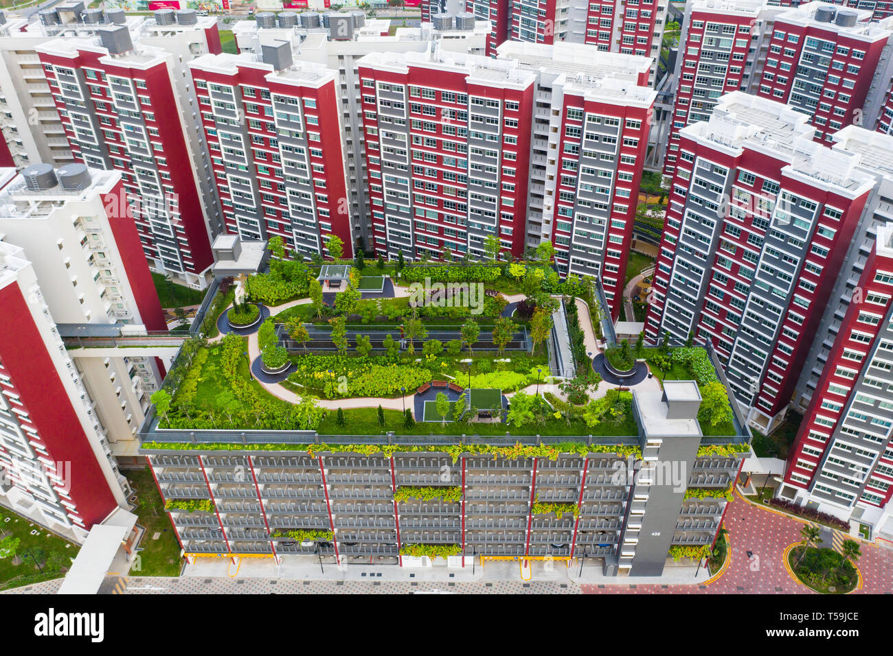 Aerial perspective of rooftop garden carpark, the purpose is for the nearby residents for a space to hang out and light exercise. Singapore. Stock Photo