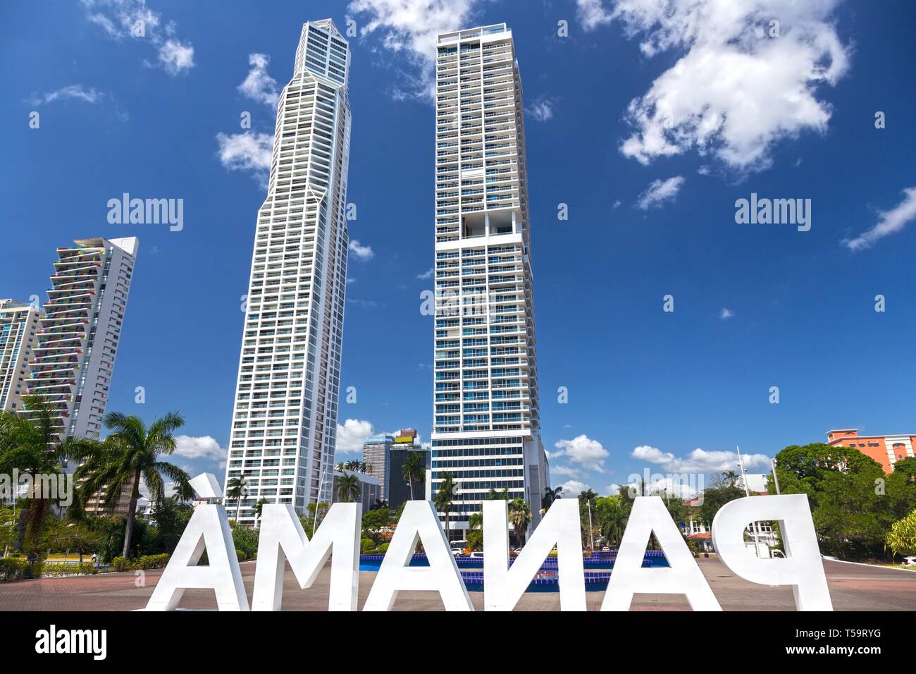 Big White Panama Letters Reverse Side on Panama City Center Waterfront with Highrise Skyscraper Condo Buildings on Skyline Stock Photo