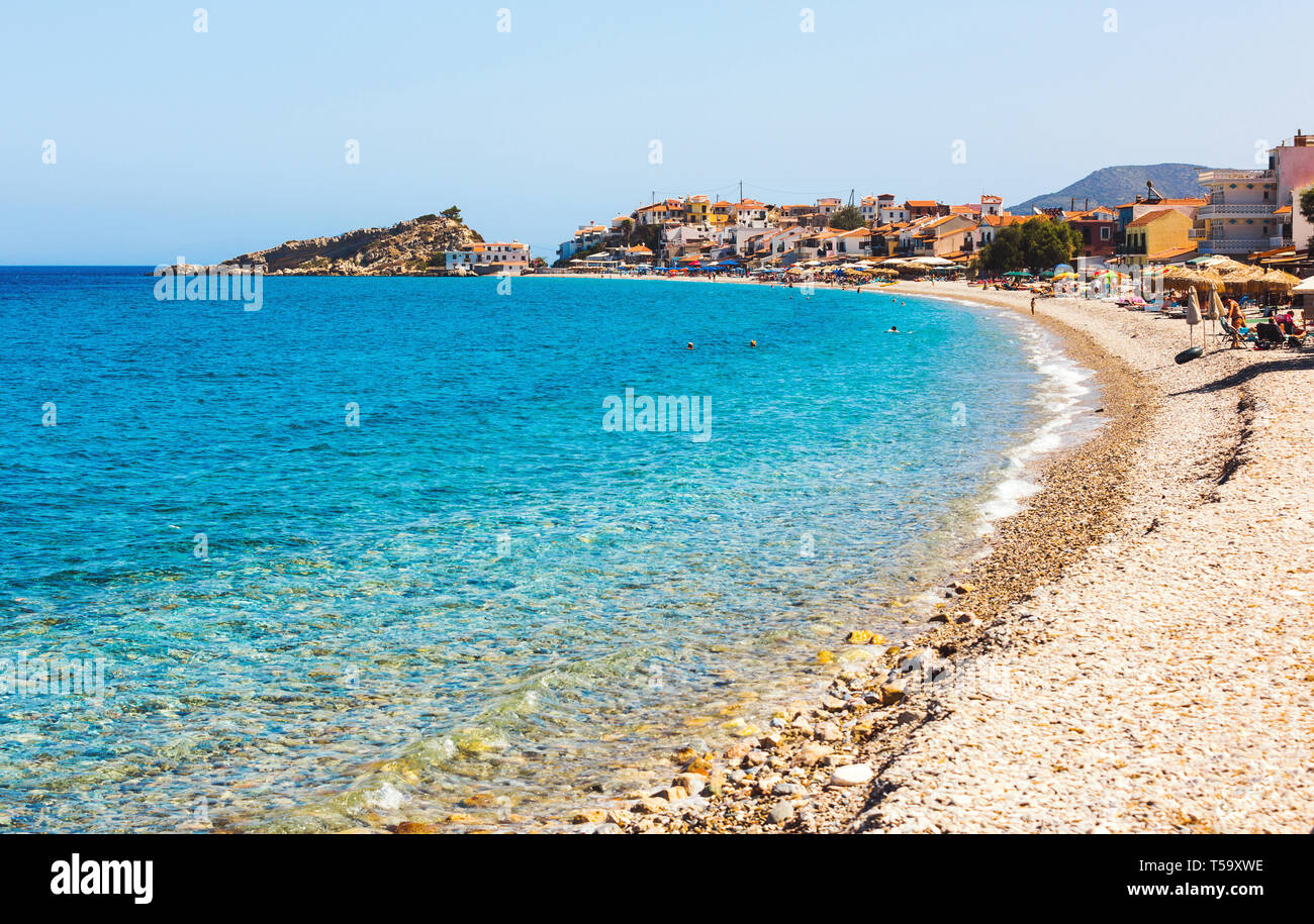 Samos island, Greece - September 12, 2017: Beautiful Kokkari beach, tourists enjoying a nice summer day on Samos Island in Greece Stock Photo