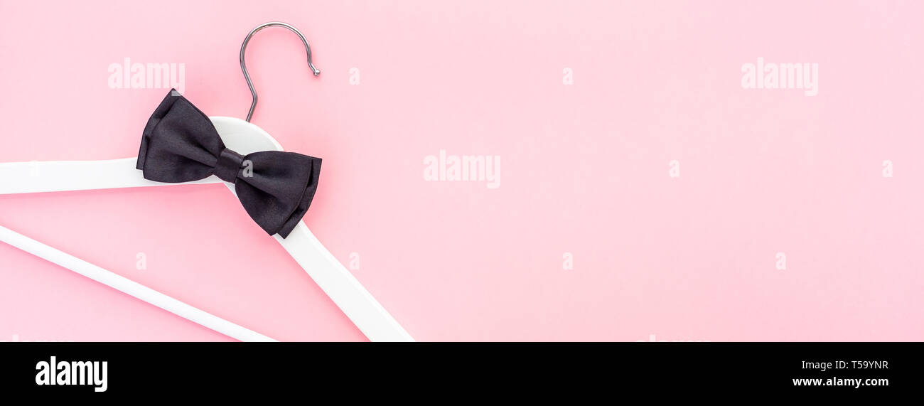 Creative top view flat lay white wooden hangers pastel millennial pink ...