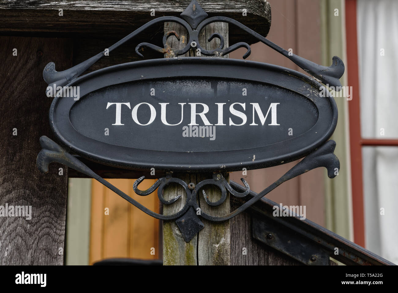 the-word-tourism-written-in-white-letters-on-a-black-decorative-sign-on